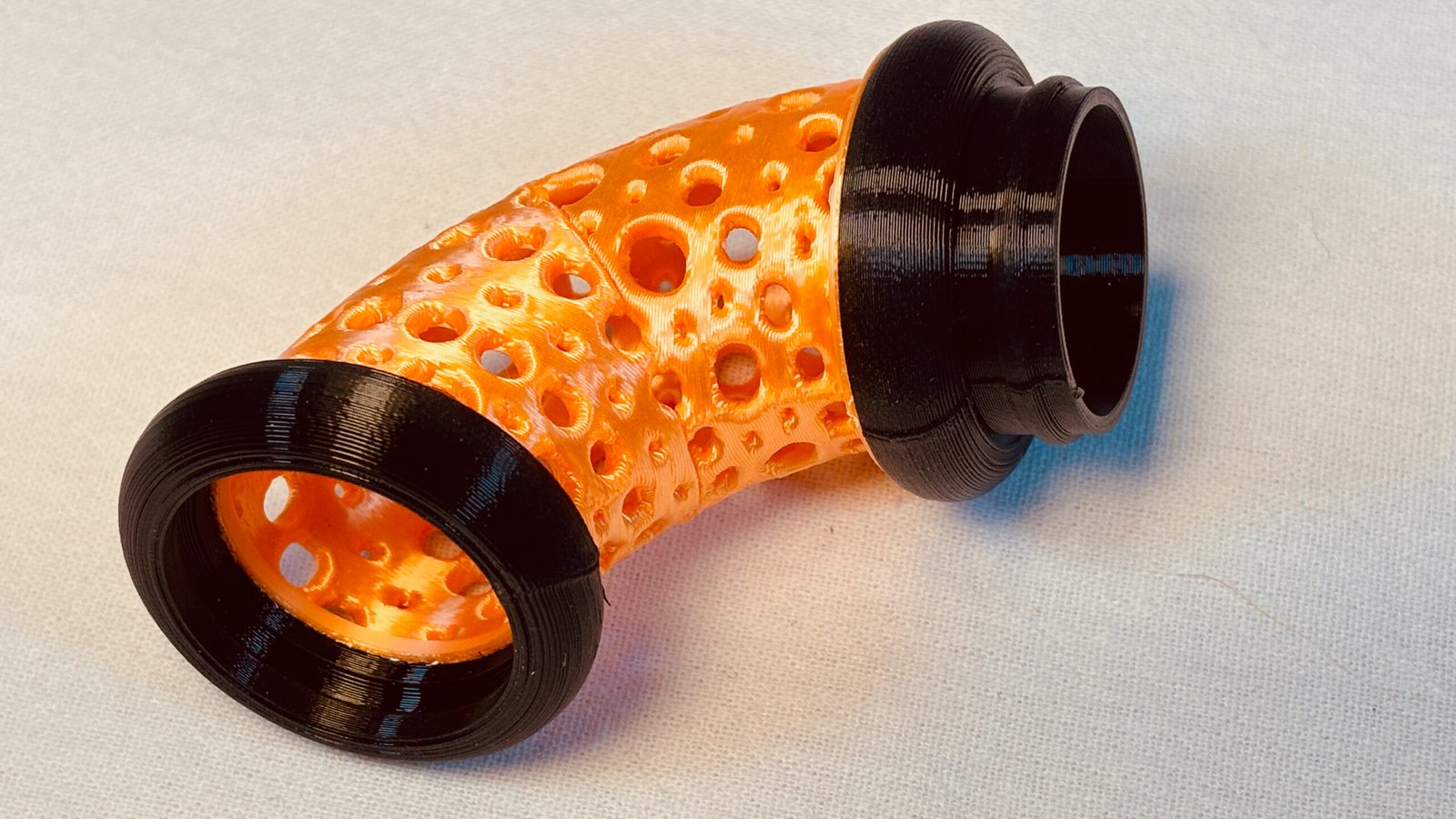 Build Super Flow Tubes into a groovy LED marble run sculpture you can display, play and dance with! Orange Curve detail. Patent Pending # 19/203,500.