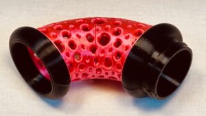 Build Super Flow Tubes into a groovy LED marble run sculpture you can display, play and dance with! Red Curve detail. Patent Pending # 19/203,500.