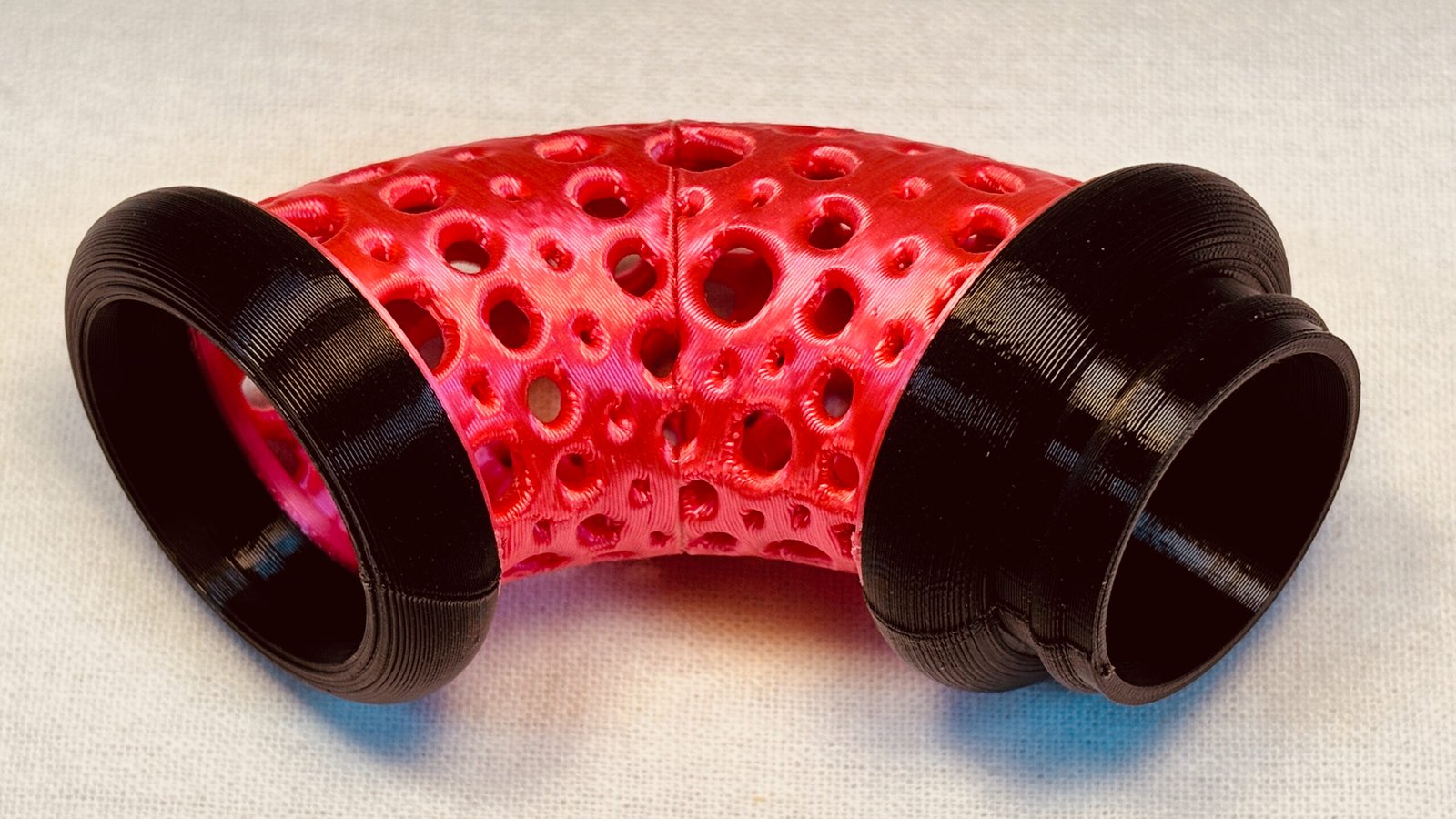 Build Super Flow Tubes into a groovy LED marble run sculpture you can display, play and dance with! Red Curve detail. Patent Pending # 19/203,500.