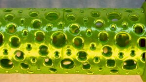 Super Flow Tubes! Straight green Tube detail, a groovy marble run sculpture you can display, play and dance with! Patent Pending # 19/203,500.