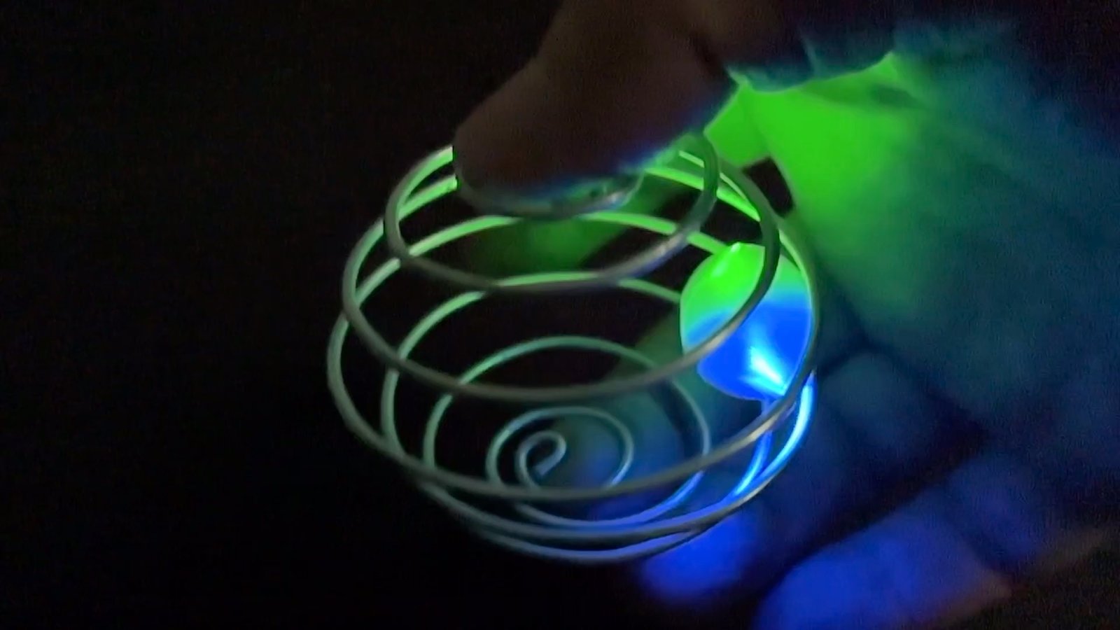 Zorbit Sphere by Super Flow Yo is a hand-held spiral cage for spinning bright LED marbles for a groovy lightshow in your hand.