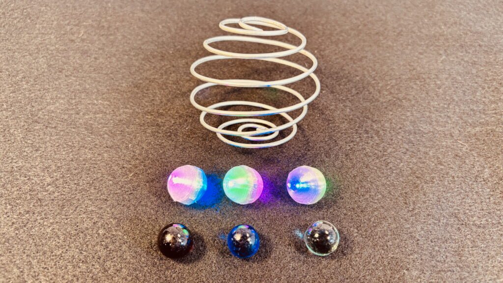 Zorbit Sphere by Super Flow Yo is a groovy hand-held spiral cage for spinning marbles, comes with 3 glass and 3 LED marbles.