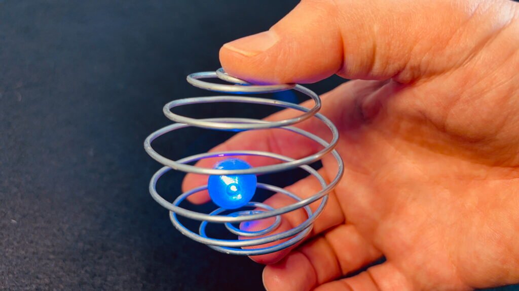 Zorbit Sphere by Super Flow Yo is a hand-held spiral cage for spinning bright LED marbles for a groovy lightshow in your hand.