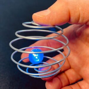 Zorbit Sphere by Super Flow Yo is a hand-held spiral cage for spinning bright LED marbles for a groovy lightshow in your hand.